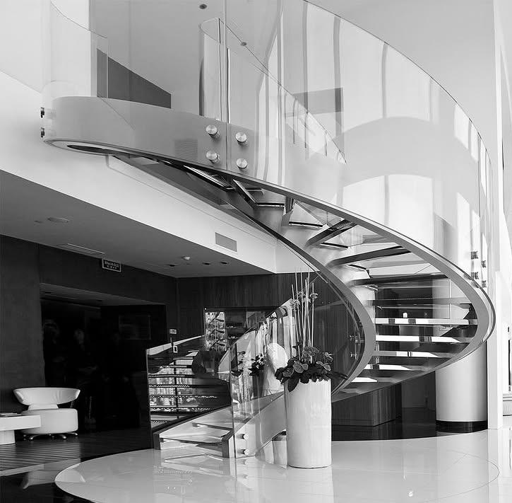Sculptural glass staircase, modern blend of elite craftsmanship